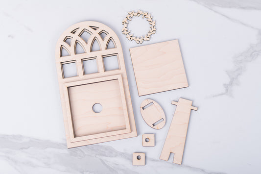 Wooden Arch frame craft kit on a marble surface