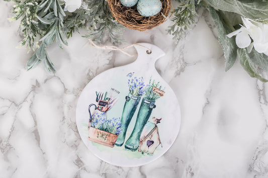 Ceramic kitchen spoon rest with lavender, herbs, and tools