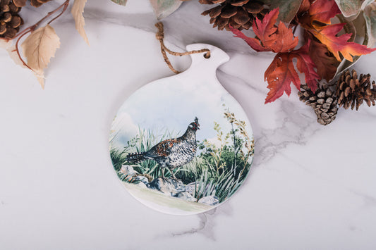 Rustic farmhouse hot pad featuring grouse