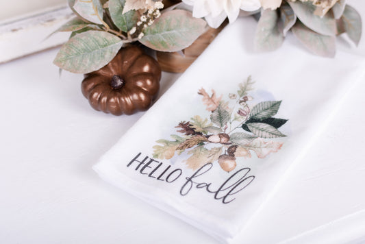 Hello Fall hand towel with acorns and oak leaves styled with fall greenery and copper pumpkin