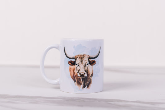 Mug with a longhorn cow design on a white background