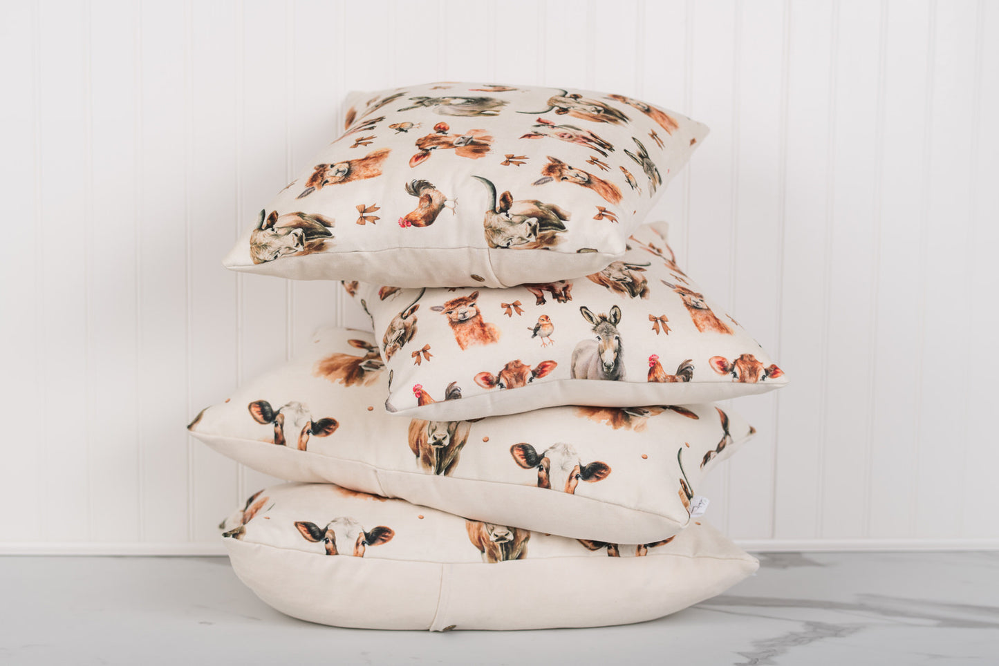 Stack of pillows with animal print on a white background