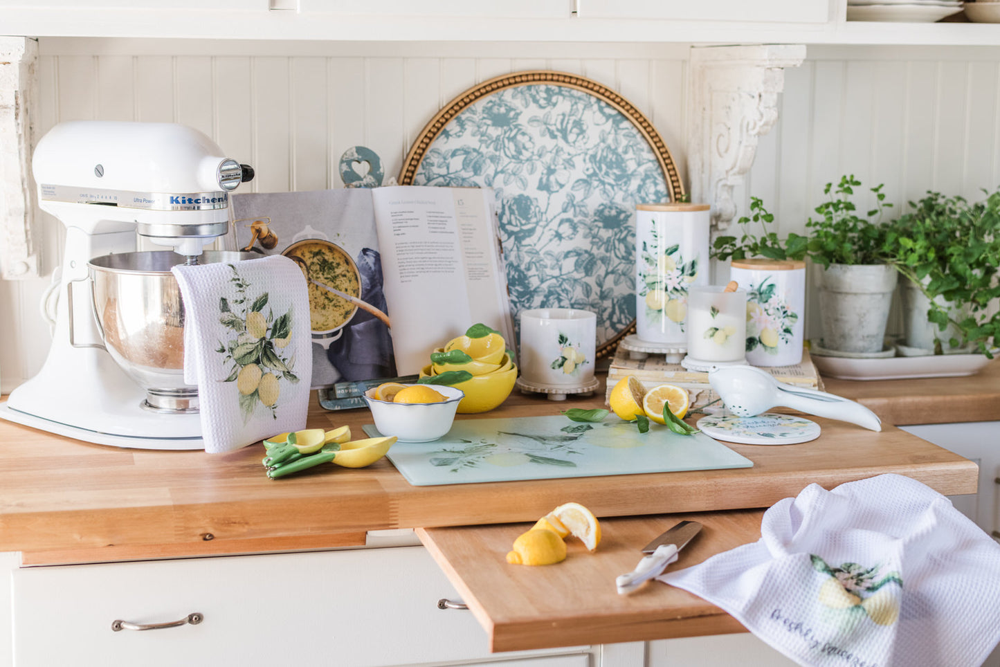 Lemon kitchen towel draped over appliance and coordinating lemon kitchen essentials