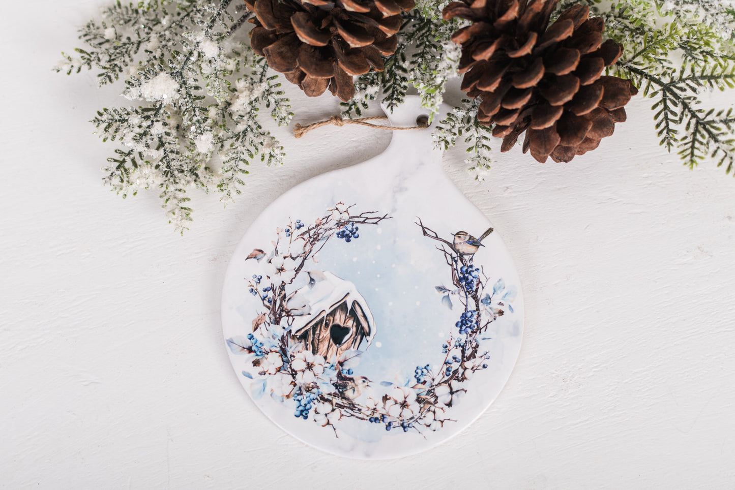 Holiday kitchen spoon rest with snowy heart birdhouse design