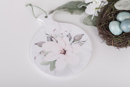 Round ceramic spoon rest with watercolor magnolia bloom