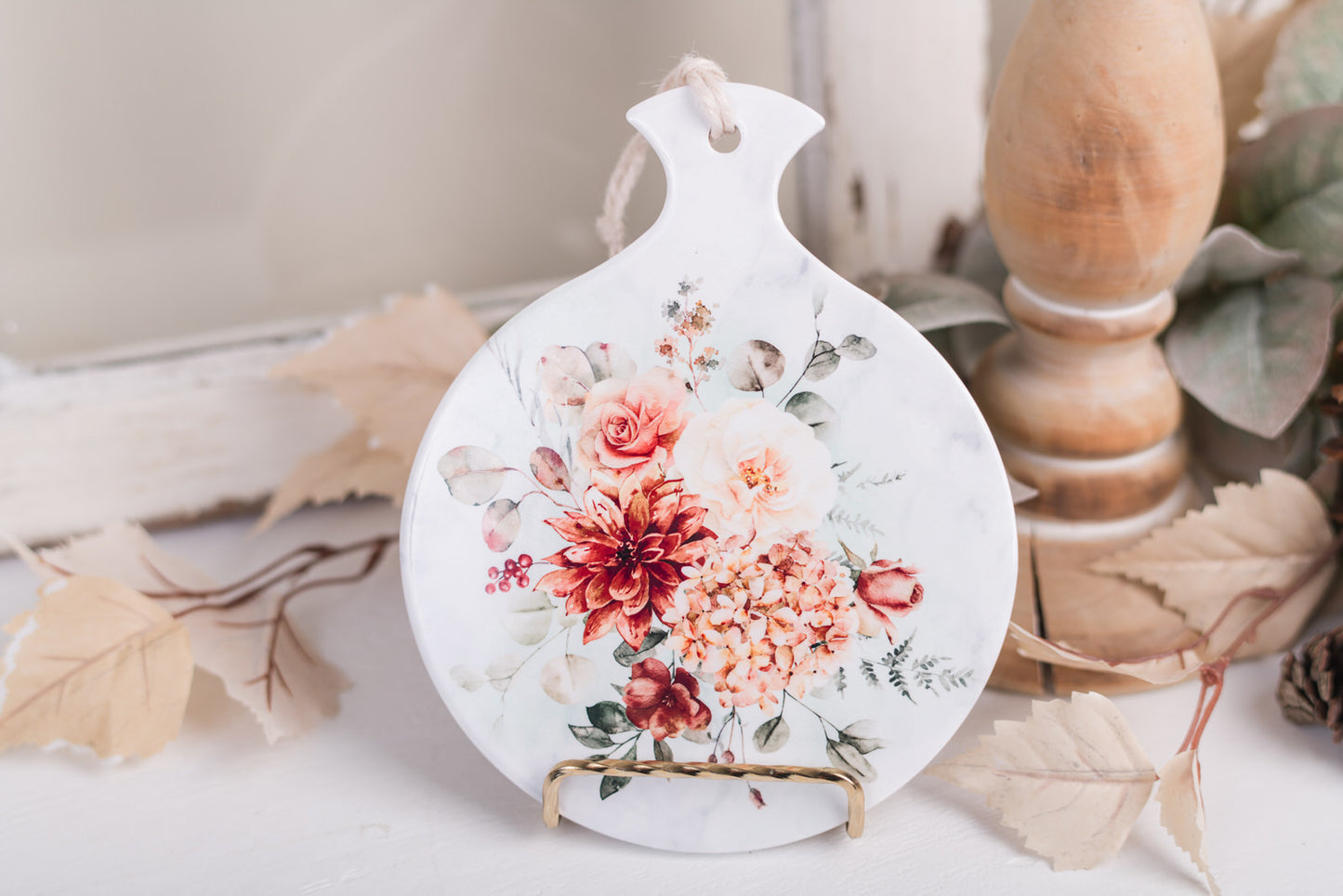 Ceramic spoon rest with hydrangeas, roses, and eucalyptus