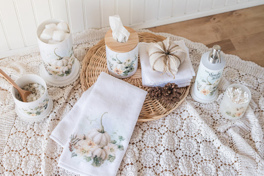 Medium ceramic jar with white pumpkins styled in cozy bathroom