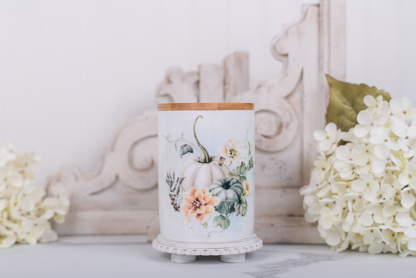 Neutral autumn bathroom jar with floral artwork