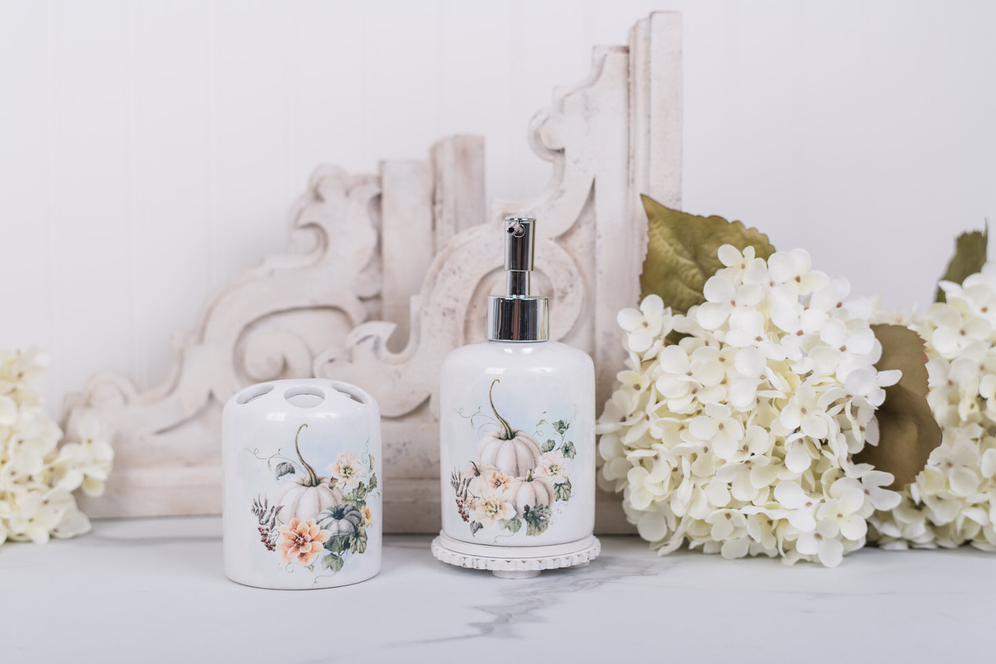 Cozy bathroom fall decor with ceramic pumpkin soap dispenser and toothbrush holder