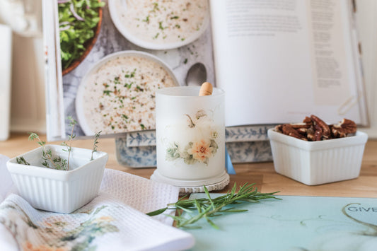 Cottage-style pumpkin canister for fall kitchen decor surrounded by baking items