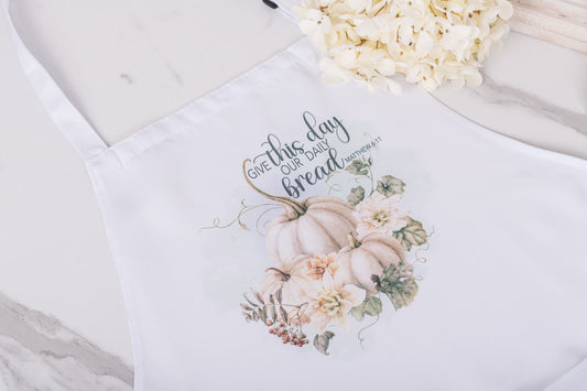 Soft fall apron on white background with pumpkin design and scripture