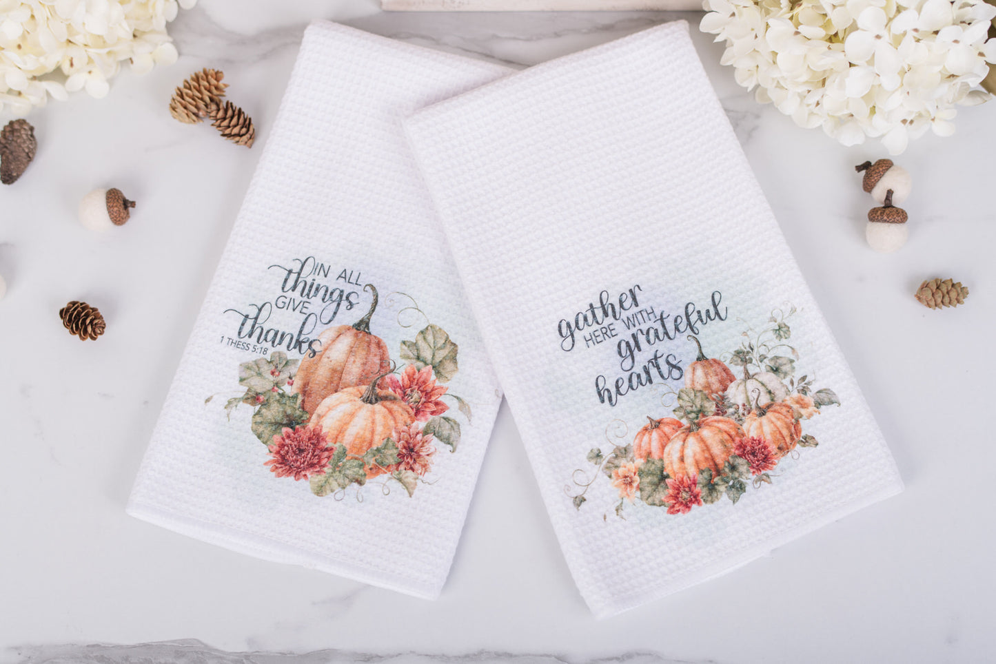 Two fall tea towels with pumpkins and scripture: Give Thanks and Grateful Hearts