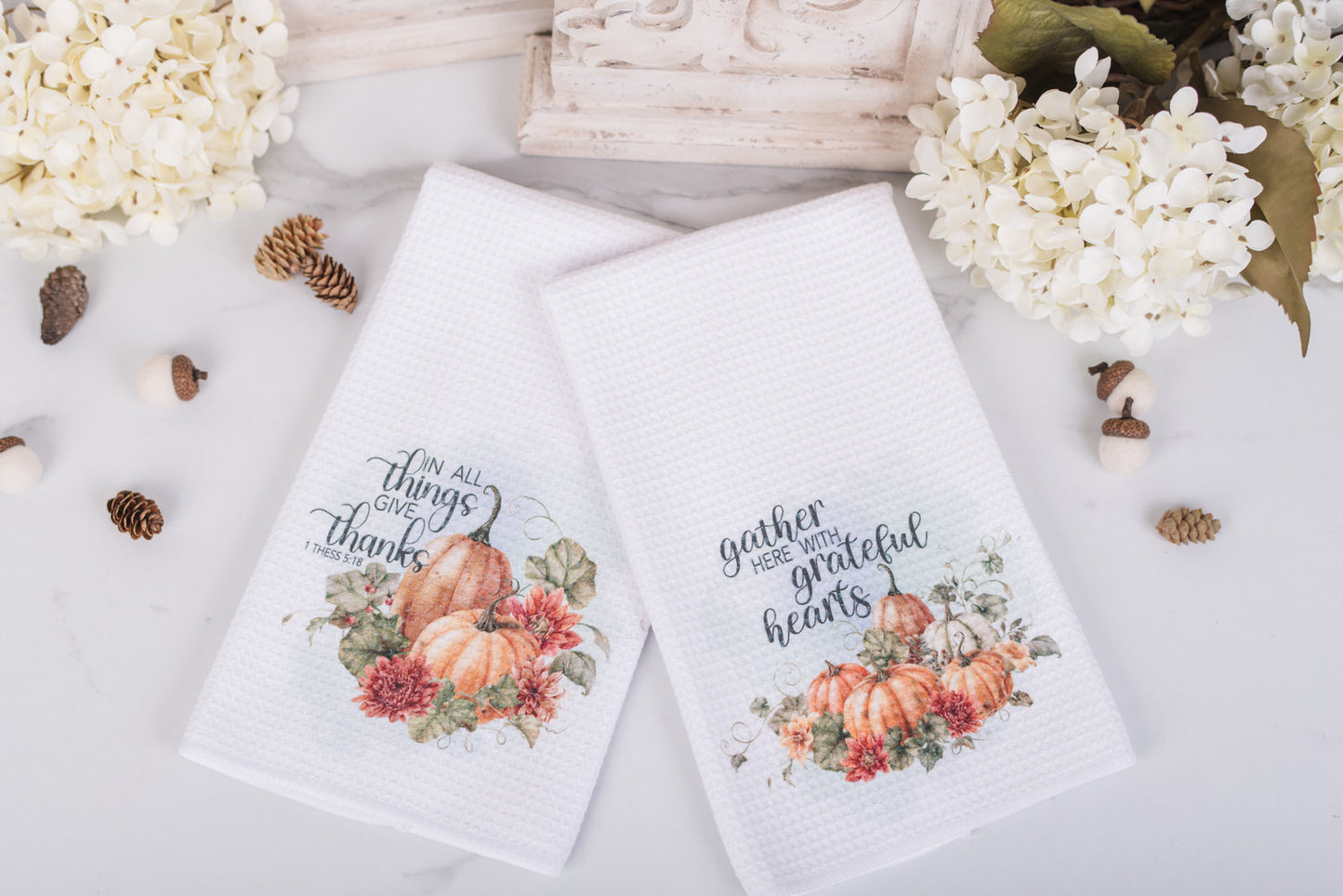 Pumpkin tea towel styled with fall florals and cozy cottage decor