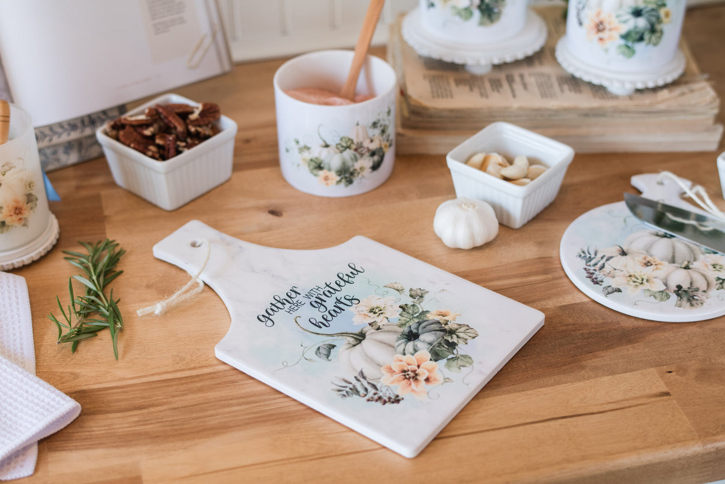 Fall scripture trivet styled with white florals and pumpkins