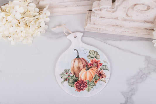 Watercoluor pumpkin round hot pad for Thanksgiving or fall hosting