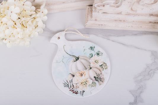 Ceramic hot pad with soft watercolor pumpkins and flowers