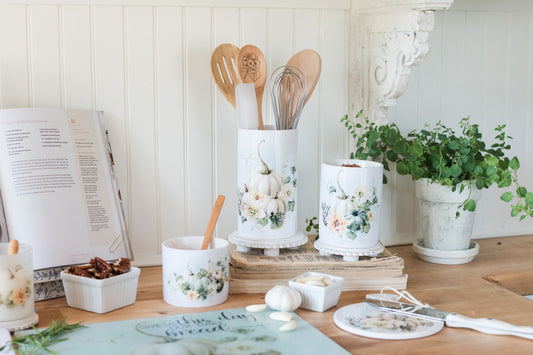 Soft fall utensil holder with white pumpkin and floral artwork displayed with fall canister and kitchen tools