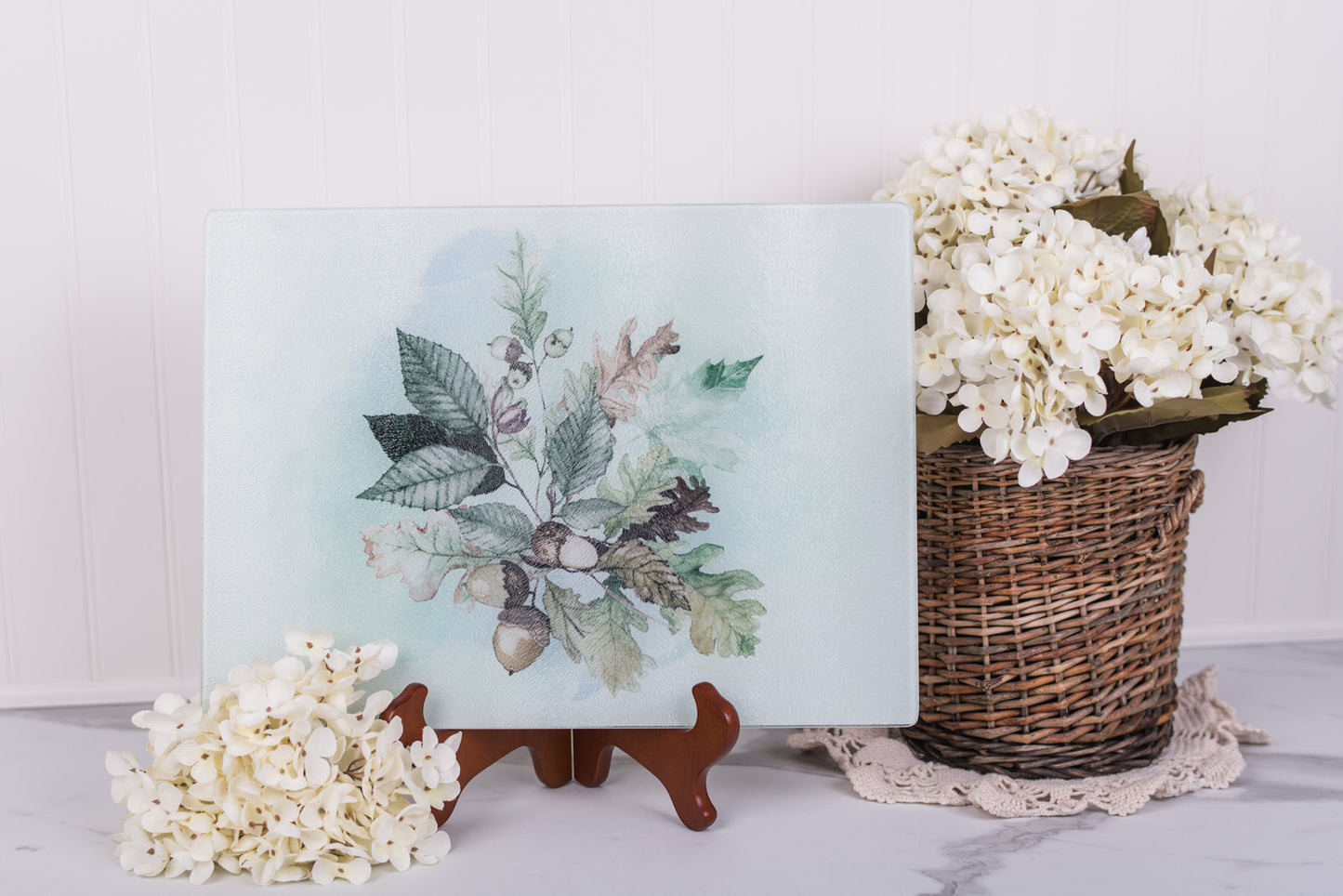 Neutral fall cutting board styled with flowers and a basket