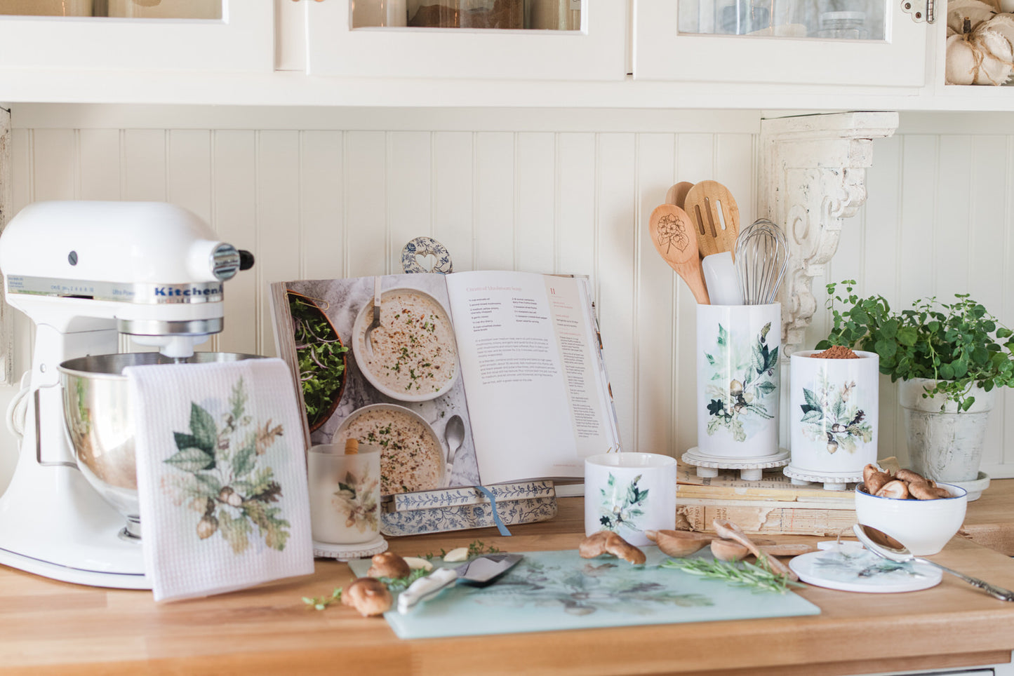 Fall kitchen counter organizer with soft watercolour leaf design on a counter with kitchen tools