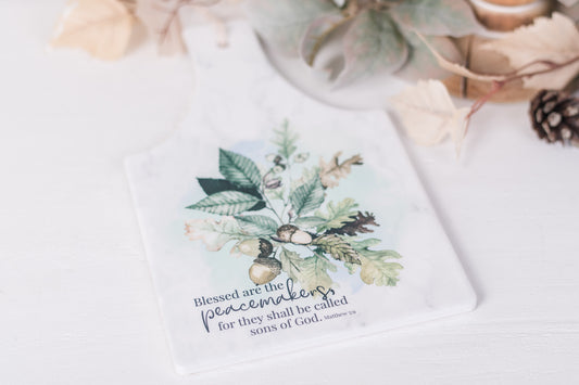 Faith-based fall trivet styled with pinecones, greenery, and seasonal accents