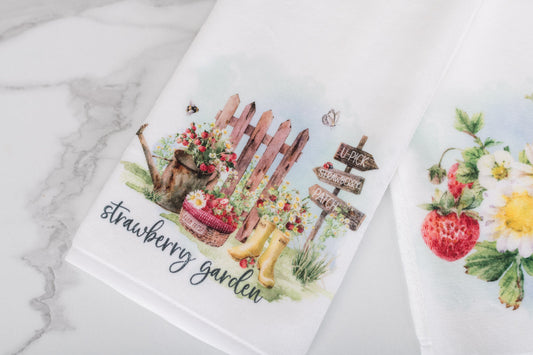 Cottage-style soft hand towel with watercolour strawberries and summer flowers for the bathroom.