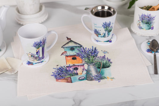 Mugs with lavender and birdhouse design on a table