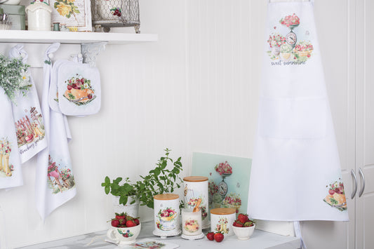 Cottage apron with watercolour strawberries and daisies, perfect for summer baking.