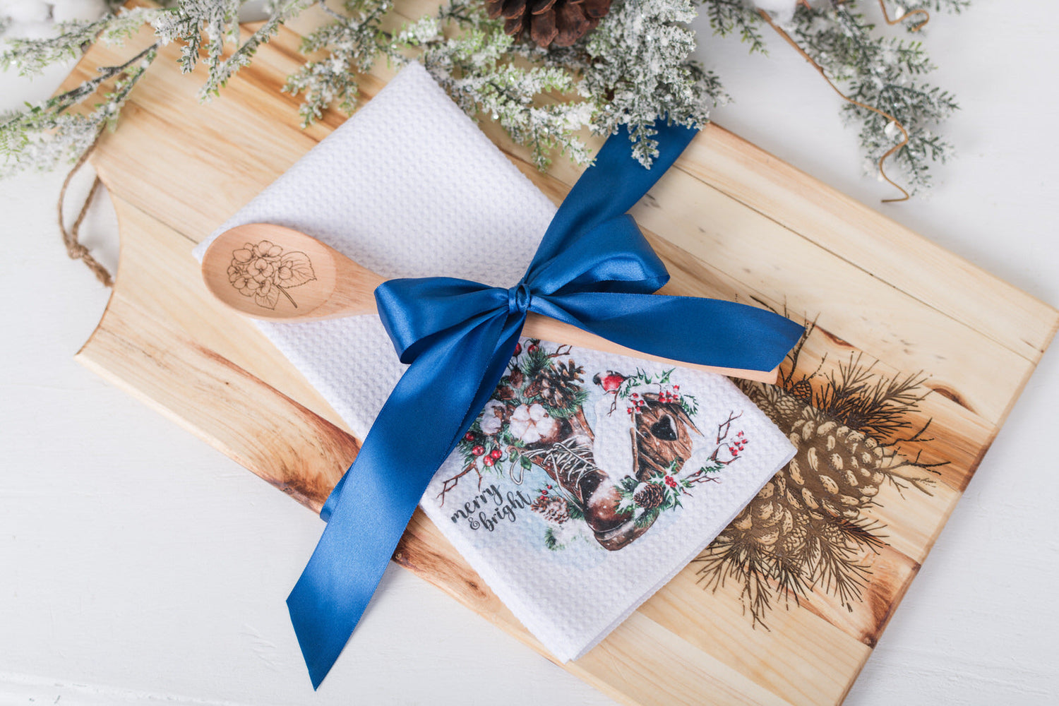 Charcuterie Board or wood cutting board with pinecone engraving bundled with a engraved wood spoon and Christmas tea towel