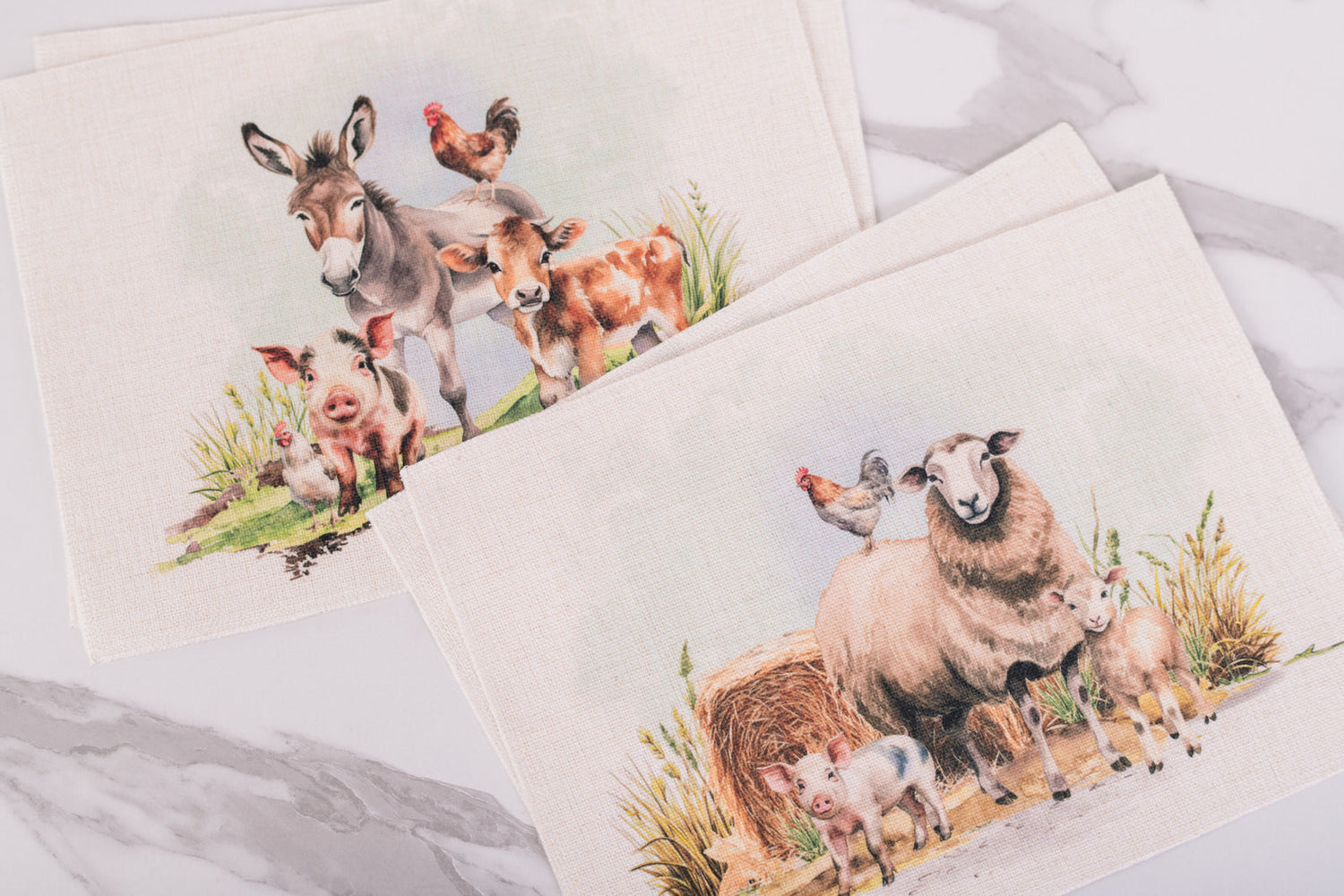 farm animals on linen placemats on a marble surface. 