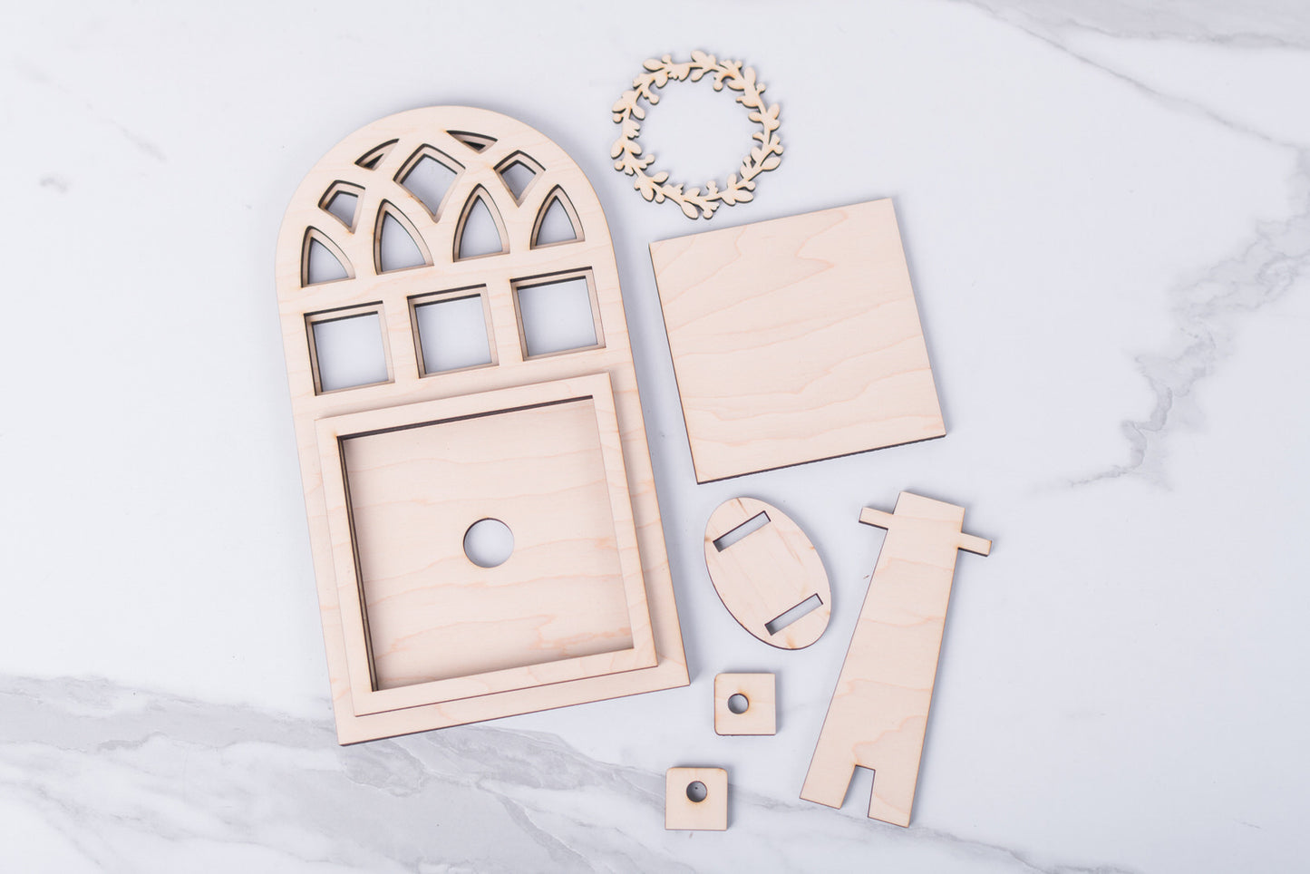 Wooden Arch frame craft kit on a marble surface