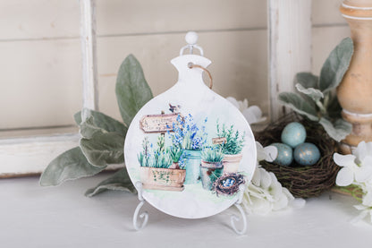 Round ceramic spoon rest with watercolor herb garden and sign