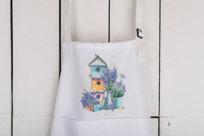 Floral child’s apron hung from farmhouse hook