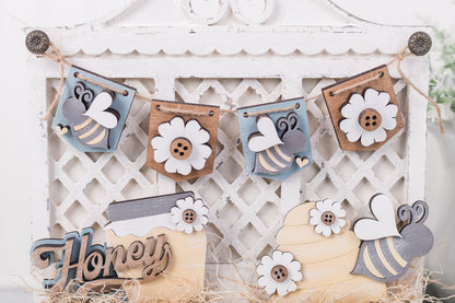 Decorative banner with bees, flowers, and 'Honey' sign on a white lattice background