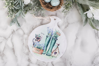 Ceramic kitchen spoon rest with lavender, herbs, and tools