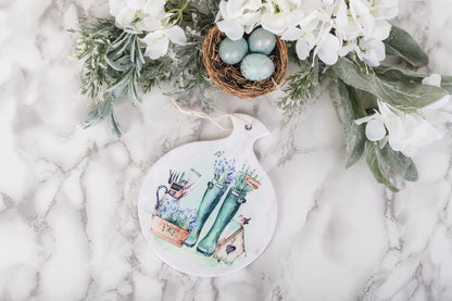 Watercolor garden scene on ceramic spoon holder with soft tones