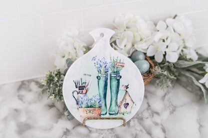 Floral spoon rest with spring boots and rustic birdhouse