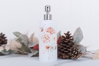 Autumn floral soap dispenser with floral design surrounded by decorative elements on a light background