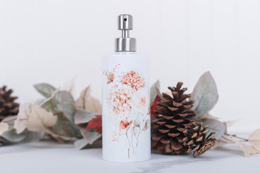 Autumn floral soap dispenser with floral design surrounded by decorative elements on a light background