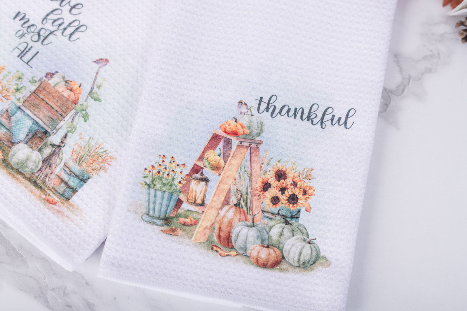 Autumn kitchen towels featuring cozy farmhouse harvest scenes