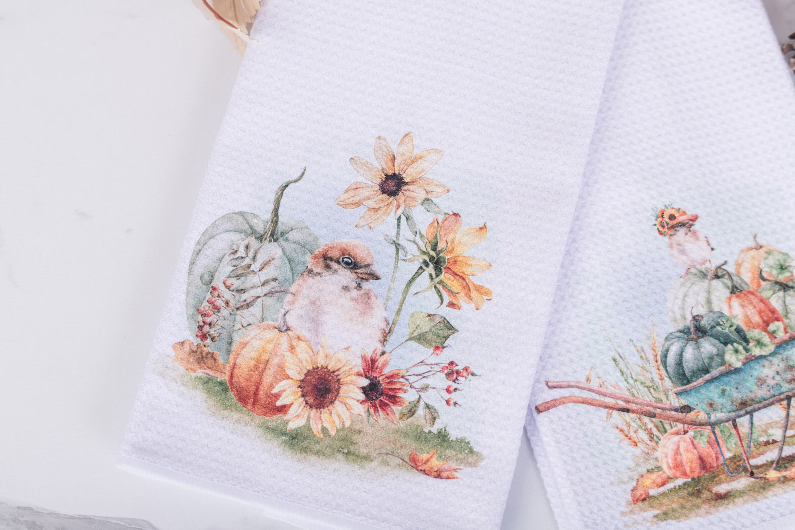 White tea towel with watercolor bird, sunflowers, and pumpkins for fall decor