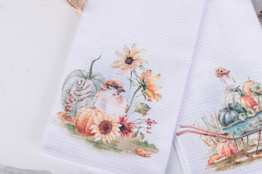 White tea towel with watercolor bird, sunflowers, and pumpkins for fall decor