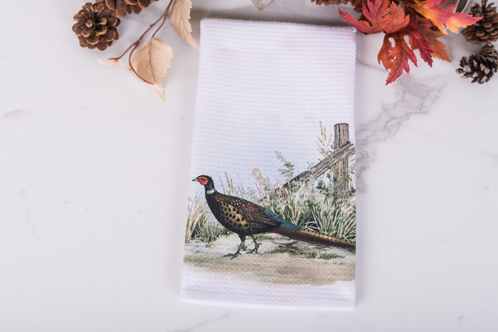 Towel with a pheasant design on a white background