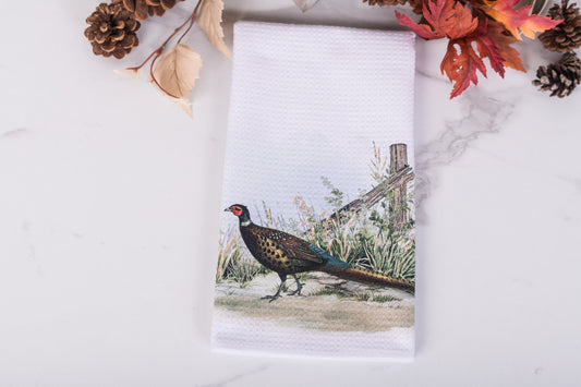 Towel with a pheasant design on a white background