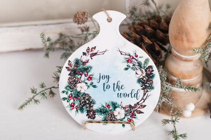 Ceramic spoon rest with Joy to the World text and pine wreath