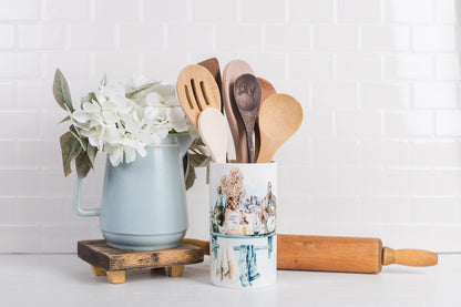 country kitchen large canister used as a utensil holder styled with a rolling pin and pitcher. 