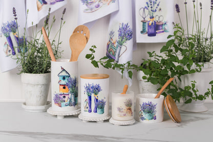 Set of ceramic canisters with watercolour lavender holding utensils 