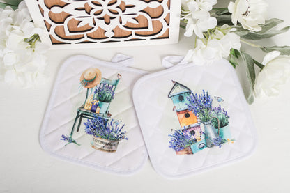 Two quilted pot holders with a colorful watercolour design featuring French lavender pots and a garden scene on a white background.