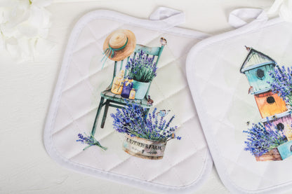 Lavender potholders laying on a white counter 