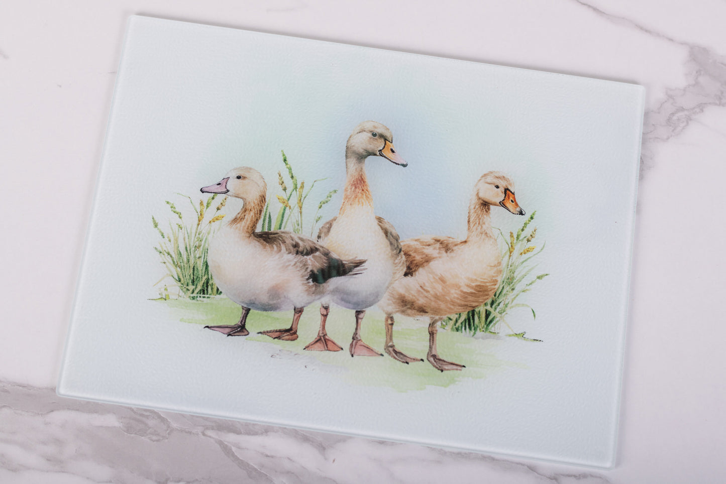 Homestead Collection glass cutting board featuring three ducks