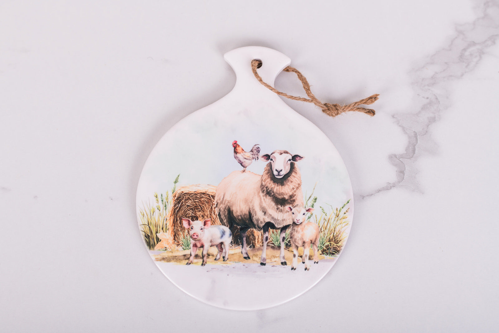 Spoon rest with sheep and farm animals design on a marble surface